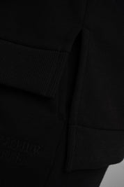 BLUZA O KROJU REGULAR FIT Z DŁUŻSZYM TYŁEM CZARNA - COOK