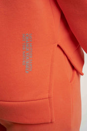 BLUZA O KROJU REGULAR FIT Z DŁUŻSZYM TYŁEM PUMPKIN POMARAŃCZOWA - COOK