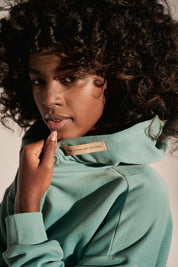 LONG ASYMMETRIC HOODED SWEATSHIRT TURQUOISE - MOZAMBIK