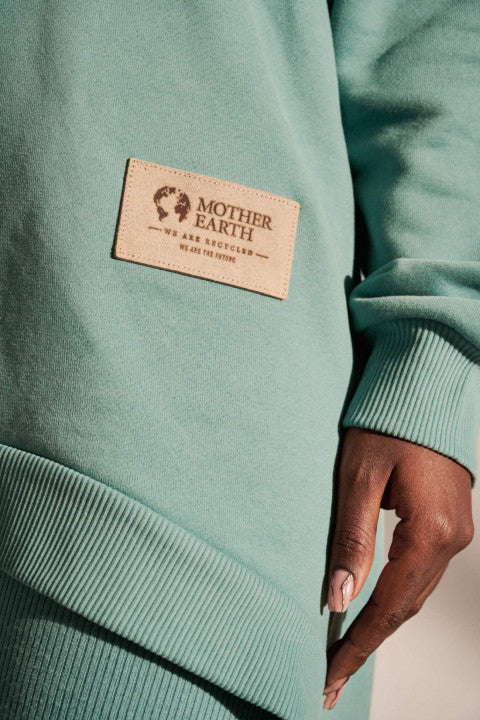 LONG ASYMMETRIC HOODED SWEATSHIRT TURQUOISE - MOZAMBIK
